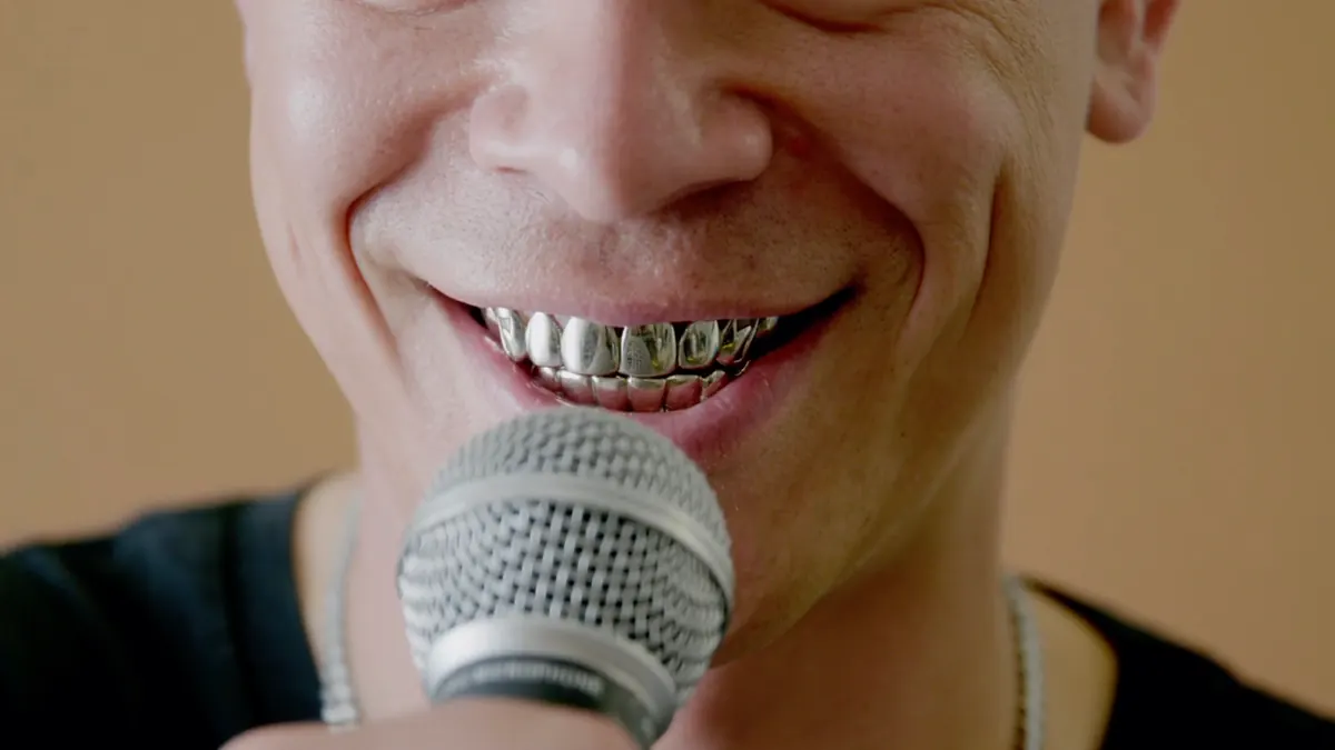 Artist singing into a microphone