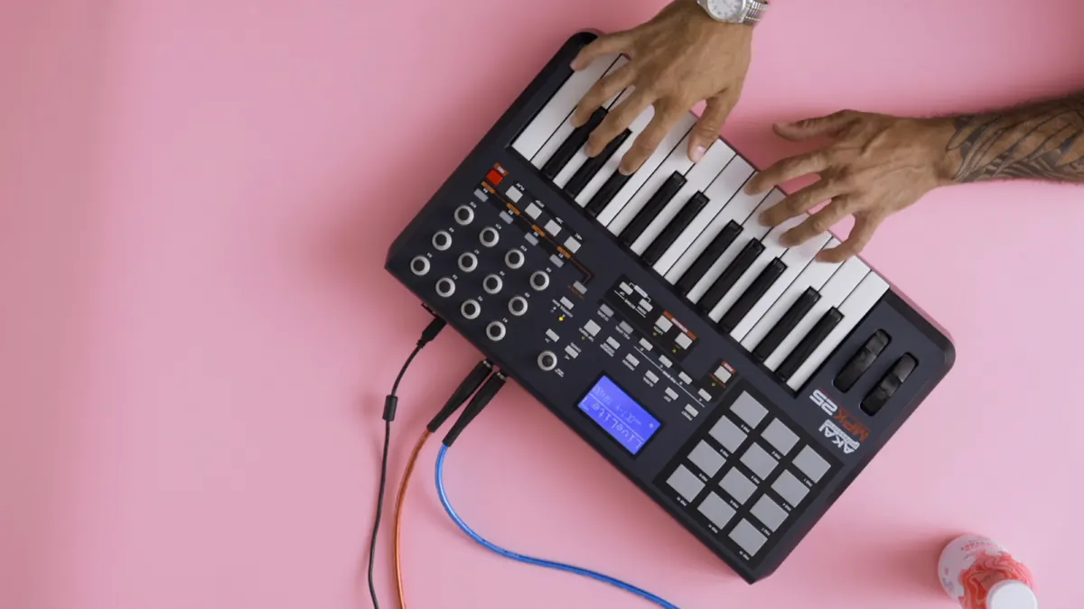 Hands on a beat pad on pink