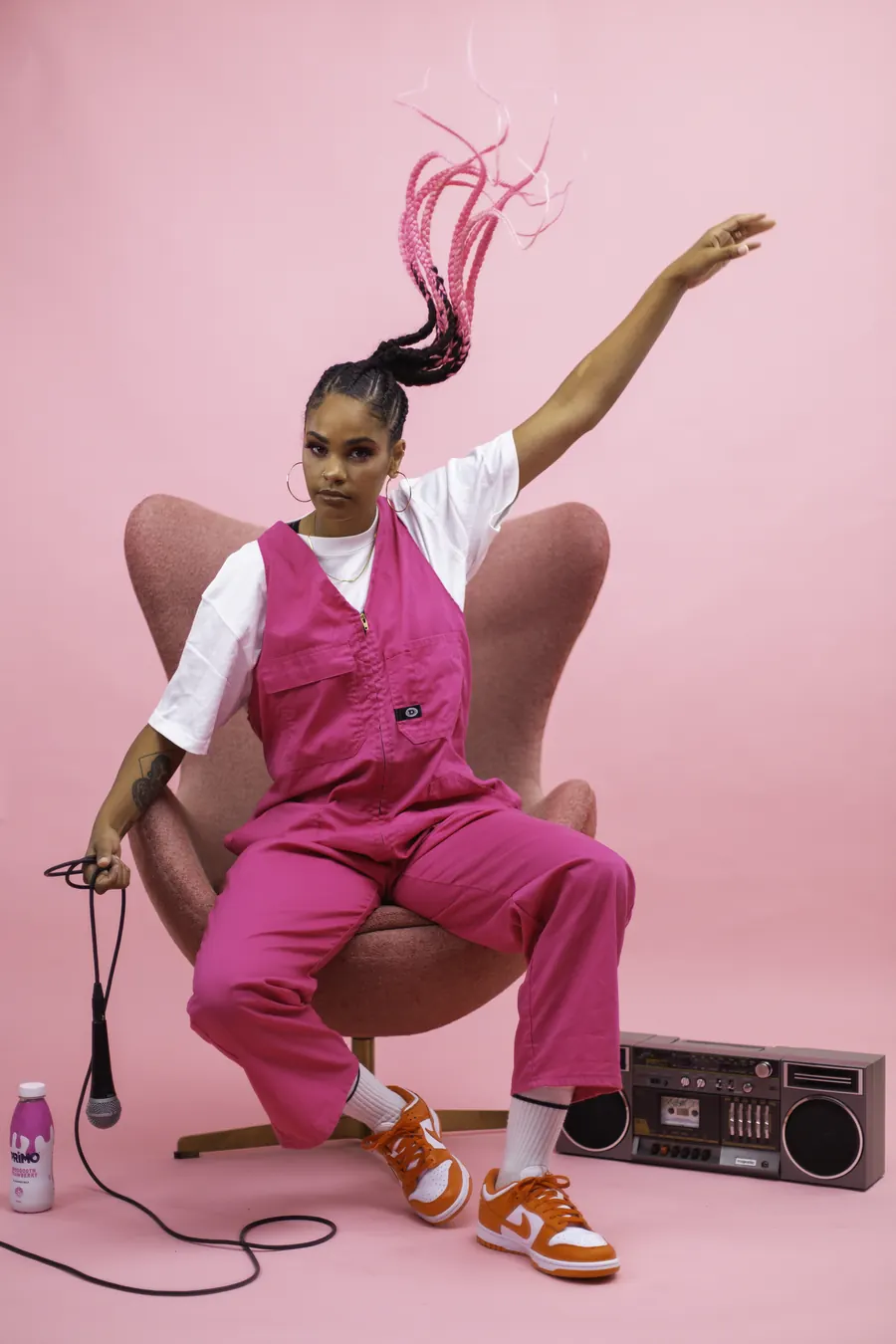 Jess B posing on the pink set